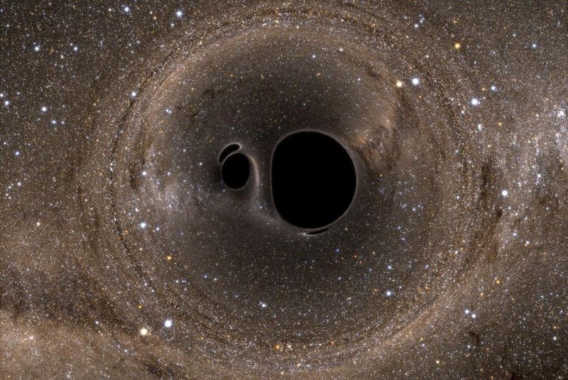 Um marco para a física e a astronomia: cientistas de vários países anunciaram nesta quinta-feira ter detectado ondas gravitacionais, ondulações do espaço-tempo que foram previstas por Albert Einstein há um século. A imagem mostra dois buracos negros se fundindo. 