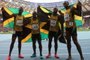 Jamaica Usain Bolt (R),Jamaica Nickel Ashmeade, Jamaica Oshane Bailey and Jamaica Nesta Carter pose after winning the men 4x100 metres relay final at the 2013 IAAF World Championships at the Luzhniki stadium in Moscow on August 18, 2013