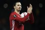 Manchester Uniteds Swedish striker Zlatan Ibrahimovic applauds the fans following the UEFA Europa League Round of 32 first-leg football match between Manchester United and Saint-Etienne at Old Trafford stadium in Manchester, north-west England, on February 16, 2017. Manchester United won the match 3-0.Oli SCARFF / AFP
