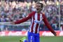Atletico Madrids French forward Antoine Griezmann celebrates after scoring during the Spanish league football match Club Atletico de Madrid vs Sevilla FC at the Vicente Calderon stadium in Madrid on March 19, 2017. / AFP PHOTO / PIERRE-PHILIPPE MARCOU