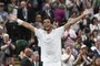 Brazil's Marcelo Melo celebrates after winning with his partner Poland's Lukasz Kubot (unseen) against Austria's Oliver Marach and Croatia's Mate Pavic during their men's doubles final match on the twelfth day of the 2017 Wimbledon Championships at The All England Lawn Tennis Club in Wimbledon, southwest London, on July 15, 2017.
Poland's Lukasz Kubot and Brazil's Marcelo Melo won 5-7, 7-5, 7-6, 3-6, 13-11. / AFP PHOTO / Glyn KIRK / RESTRICTED TO EDITORIAL USE