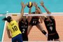 Brazils Gabi (L) spikes the ball against Belgiums Biebauw, Vandesteene and Aelbrecht (R)  during  a World Grand Prix 2015 volleyball match, in Sao Paulo, Brazil on July 10 2015. AFP PHOTO / Miguel SCHINCARIOL