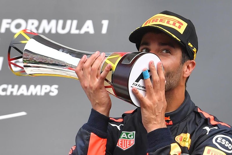  

Third placed Red Bulls Australian driver Daniel Ricciardo kisses his trophy after the Belgian Formula One Grand Prix at the Spa-Francorchamps circuit in Spa on August 27, 2017. / AFP PHOTO / LOIC VENANCE

Editoria: SPO
Local: Spa-Francorchamps
Indexador: LOIC VENANCE
Secao: motor racing
Fonte: AFP
Fotógrafo: STF