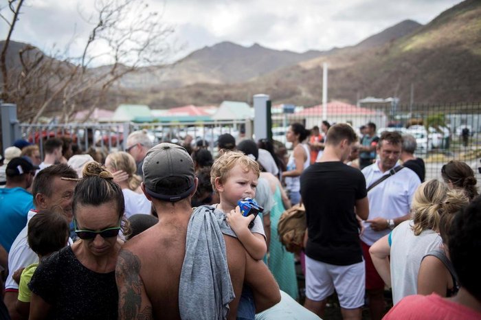 People trying to leave Saint-Martin gather in front of Grand-Case Esperance airport entrance, on September 10, 2017 on the French Carribean island of Saint-Martin after it was devastated by Irma hurricane.
People on the islands of Saint Martin and Saint Barts turn to the colossal task of rebuilding after Hurricane Irma laid waste to their infrastructure and shattered their lives. / AFP PHOTO / Martin BUREAU
Editoria: DIS
Local: Grand-Case
Indexador: MARTIN BUREAU
Secao: disaster (general)
Fonte: AFP
Fotógrafo: STF
People trying to leave Saint-Martin gather in front of Grand-Case Esperance airport entrance, on September 10, 2017 on the French Carribean island of Saint-Martin after it was devastated by Irma hurricane.
People on the islands of Saint Martin and Saint Barts turn to the colossal task of rebuilding after Hurricane Irma laid waste to their infrastructure and shattered their lives. / AFP PHOTO / Martin BUREAU
Editoria: DIS
Local: Grand-Case
Indexador: MARTIN BUREAU
Secao: disaster (general)
Fonte: AFP
Fotógrafo: STF