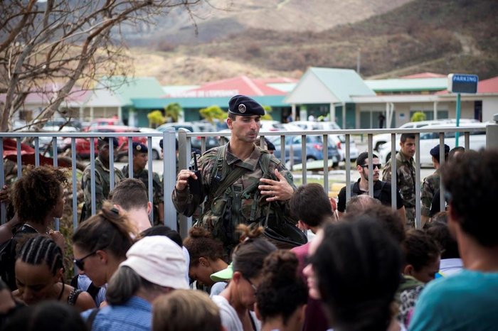 A French soldier tries to calm down people trying to leave Saint-Martin, on September 10, 2017 at Grand-Case Esperance airport on the French Carribean island of Saint-Martin after it was devastated by Irma hurricane.
People on the islands of Saint Martin and Saint Barts turn to the colossal task of rebuilding after Hurricane Irma laid waste to their infrastructure and shattered their lives. / AFP PHOTO / Martin BUREAU
Editoria: DIS
Local: Grand-Case
Indexador: MARTIN BUREAU
Secao: disaster (general)
Fonte: AFP
Fotógrafo: STF
A French soldier tries to calm down people trying to leave Saint-Martin, on September 10, 2017 at Grand-Case Esperance airport on the French Carribean island of Saint-Martin after it was devastated by Irma hurricane.
People on the islands of Saint Martin and Saint Barts turn to the colossal task of rebuilding after Hurricane Irma laid waste to their infrastructure and shattered their lives. / AFP PHOTO / Martin BUREAU
Editoria: DIS
Local: Grand-Case
Indexador: MARTIN BUREAU
Secao: disaster (general)
Fonte: AFP
Fotógrafo: STF