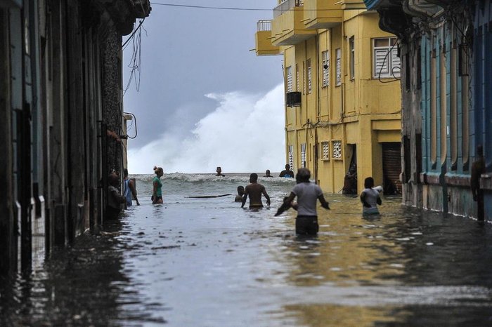 Cubans wade through a flooded street in Havana, on September 10, 2017.
Deadly Hurricane Irma battered central Cuba on Saturday, knocking down power lines, uprooting trees and ripping the roofs off homes as it headed towards Florida. Authorities said they had evacuated more than a million people as a precaution, including about 4,000 in the capital.
/ AFP PHOTO / YAMIL LAGE
Editoria: WEA
Local: Havana
Indexador: YAMIL LAGE
Secao: report
Fonte: AFP
Fotógrafo: STF
Cubans wade through a flooded street in Havana, on September 10, 2017.
Deadly Hurricane Irma battered central Cuba on Saturday, knocking down power lines, uprooting trees and ripping the roofs off homes as it headed towards Florida. Authorities said they had evacuated more than a million people as a precaution, including about 4,000 in the capital.
/ AFP PHOTO / YAMIL LAGE
Editoria: WEA
Local: Havana
Indexador: YAMIL LAGE
Secao: report
Fonte: AFP
Fotógrafo: STF