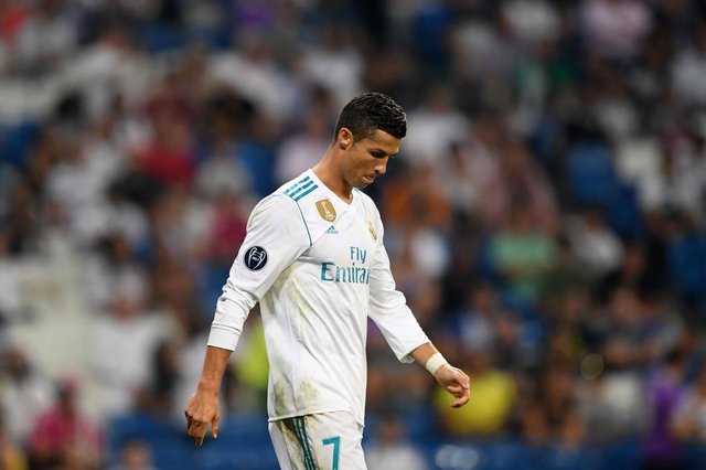 Real Madrids forward from Portugal Cristiano Ronaldo leaves the pitch after the UEFA Champions League football match Real Madrid CF vs APOEL FC at the Santiago Bernabeu stadium in Madrid on September 13, 2017. / AFP PHOTO / GABRIEL BOUYSEditoria: SPOLocal: MadridIndexador: GABRIEL BOUYSSecao: soccerFonte: AFPFotógrafo: STF Real Madrids forward from Portugal Cristiano Ronaldo leaves the pitch after the UEFA Champions League football match Real Madrid CF vs APOEL FC at the Santiago Bernabeu stadium in Madrid on September 13, 2017. / AFP PHOTO / GABRIEL BOUYSEditoria: SPOLocal: MadridIndexador: GABRIEL BOUYSSecao: soccerFonte: AFPFotógrafo: STF