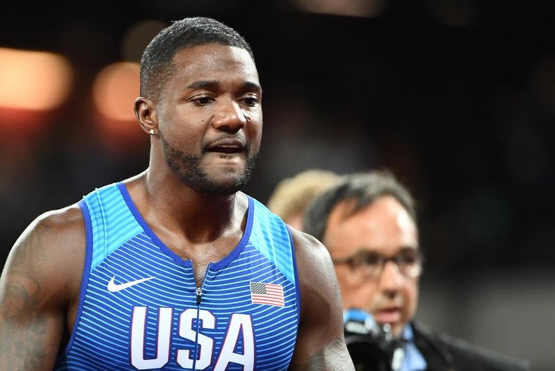 US athlete Justin Gatlin reacts after winning the final of the mens 100m athletics event at the 2017 IAAF World Championships at the London Stadium in London on August 5, 2017. / AFP PHOTO / Jewel SAMAD