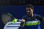 Brazils Rogerio Dutra Silva returns the ball to Russias Evgeny Donskoy during their tennis match at the Kremlin Cup tennis tournament in Moscow on October 17, 2017. / AFP PHOTO / Yuri KADOBNOV