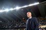 Real Madrids French head coach Zinedine Zidane looks on during the FIFA Club World Cup semi-final match in the Emirati capital Abu Dhabi on December 13, 2017. / AFP PHOTO / GIUSEPPE CACACE