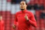  (FILES) This file photo taken on November 18, 2017 shows Southamptons Dutch defender Virgil van Dijk warms up ahead of  the English Premier League football match between Liverpool and Southampton at Anfield in Liverpool, north west England on November 18, 2017.Liverpool have signed Southamptons Virgil van Dijk, a statement on the clubs website said on December 27, 2017, for a reported £75 million ($100 million, 84 million euros) in a deal that will make him the worlds most expensive defender. / AFP PHOTO / / RESTRICTED TO EDITORIAL USE. No use with unauthorized audio, video, data, fixture lists, club/league logos or live services. Online in-match use limited to 75 images, no video emulation. No use in betting, games or single club/league/player publications.  / Editoria: SPOLocal: LiverpoolIndexador: PAUL ELLISSecao: soccerFonte: AFPFotógrafo: STF