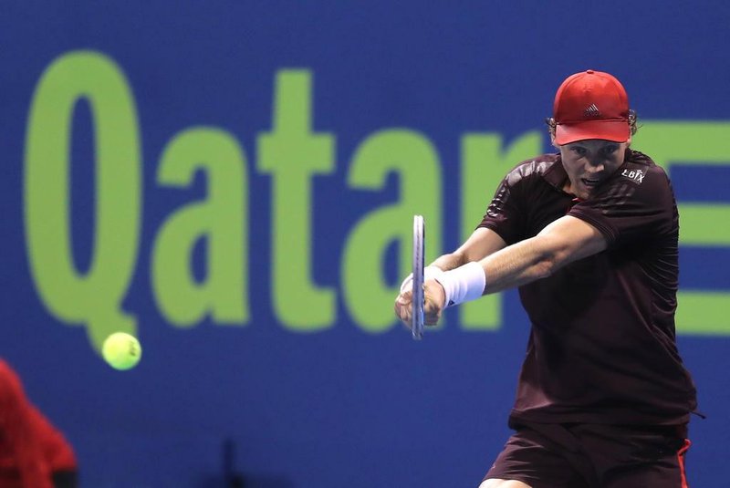 Tomas Berdych of the Czech Republic returns the ball to Jan-Lennard Struff of Germany during the first round of the ATP Qatar Open tennis competition in Doha on January 2, 2018.  / AFP PHOTO / KARIM JAAFAR