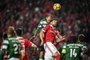 Sporting's Dutch forward Bas Dost (L) heads the ball with Benfica's Brazilian defender Jardel during the Portuguese league football match SL Benfica vs Sporting CP at the Luz stadium in Lisbon on January 3, 2018. / AFP PHOTO / PATRICIA DE MELO MOREIRA