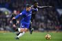 Chelseas Belgian midfielder Eden Hazard (L) competes with Leicester Citys Nigerian midfielder Wilfred Ndidi (R) during the English Premier League football match between Chelsea and Leicester City at Stamford Bridge in London on January 13, 2018. / AFP PHOTO / Glyn KIRK / RESTRICTED TO EDITORIAL USE. No use with unauthorized audio, video, data, fixture lists, club/league logos or live services. Online in-match use limited to 75 images, no video emulation. No use in betting, games or single club/league/player publications.  / 