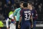 French referee Clement Turpin argues with Paris Saint-Germains Brazilian defender Daniel Alves after giving him a red card during the French L1 football match between Olympique Lyonnais and Paris-Saint Germain (PSG) at Groupama stadium in Decines-Charpieu on January 21, 2018. / AFP PHOTO / JEFF PACHOUD