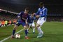 Barcelonas Brazilian midfielder Philippe Coutinho (L) challenges Espanyols Spanish midfielder David Lopez (R) and Espanyols Spanish midfielder Oscar Melendo (C) during the Spanish Copa del Rey (Kings cup) quarter-final second leg football match between FC Barcelona and RCD Espanyol at the Camp Nou stadium in Barcelona on January 25, 2018.  / AFP PHOTO / LLUIS GENE