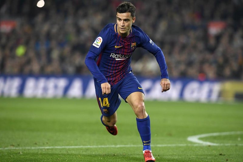 Barcelonas Brazilian midfielder Philippe Coutinho runs during the Spanish Copa del Rey (Kings cup) quarter-final second leg football match between FC Barcelona and RCD Espanyol at the Camp Nou stadium in Barcelona on January 25, 2018.  / AFP PHOTO / LLUIS GENE
