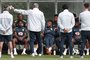 Brazil's striker Neymar (C) sits with teammates as they lisen to Brazil's head coach Tite during a team training session at Tottenham Hotspur's Enfield Training Centre, north-east of London, on June 5, 2018 ahead their International friendly football match against Austria.  
