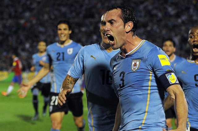 Uruguays Diego Godin celebrates after scoring against Chile during their Russia 2018 FIFA World Cup South American Qualifiers football match, in Montevideo, on November 17, 2015. AFP PHOTO / MIGUEL ROJO Uruguays Diego Godin celebrates after scoring against Chile during their Russia 2018 FIFA World Cup South American Qualifiers football match, in Montevideo, on November 17, 2015. AFP PHOTO / MIGUEL ROJO
