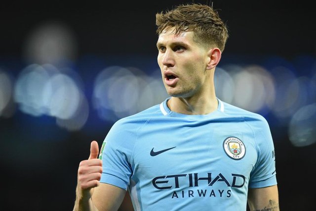 Manchester Citys English defender John Stones gestures during the English League Cup semi-final first leg football match between Manchester City and Bristol City at the Etihad Stadium in Manchester, north west England, on January 9, 2018. / AFP PHOTO / Oli SCARFF / RESTRICTED TO EDITORIAL USE. No use with unauthorized audio, video, data, fixture lists, club/league logos or live services. Online in-match use limited to 75 images, no video emulation. No use in betting, games or single club/league/player publications. / Manchester Citys English defender John Stones gestures during the English League Cup semi-final first leg football match between Manchester City and Bristol City at the Etihad Stadium in Manchester, north west England, on January 9, 2018. / AFP PHOTO / Oli SCARFF / RESTRICTED TO EDITORIAL USE. No use with unauthorized audio, video, data, fixture lists, club/league logos or live services. Online in-match use limited to 75 images, no video emulation. No use in betting, games or single club/league/player publications. /