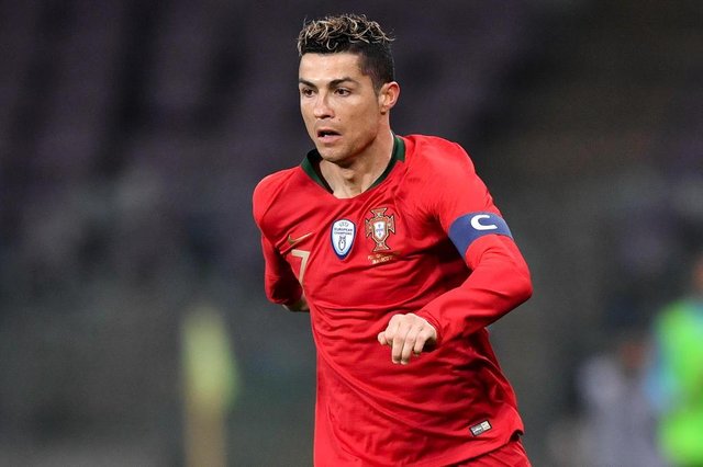 (FILES) In this file photo taken on March 26, 2018 Portugals forward Cristiano Ronaldo controls the ball during the international friendly football match between Portugal and Netherlands at Stade de Geneve stadium in Geneva on March 26, 2018. / AFP PHOTO / Fabrice COFFRINI (FILES) In this file photo taken on March 26, 2018 Portugals forward Cristiano Ronaldo controls the ball during the international friendly football match between Portugal and Netherlands at Stade de Geneve stadium in Geneva on March 26, 2018. / AFP PHOTO / Fabrice COFFRINI