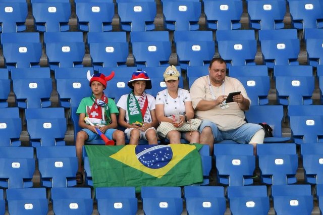 Early fans take their seats prior to the Russia 2018 World Cup Group E football match between Brazil and Switzerland at the Rostov Arena in Rostov-On-Don on June 17, 2018. / AFP PHOTO / KHALED DESOUKI / RESTRICTED TO EDITORIAL USE - NO MOBILE PUSH ALERTS/DOWNLOADSEditoria: SPOLocal: Rostov-on-DonIndexador: KHALED DESOUKISecao: soccerFonte: AFPFotógrafo: STF Early fans take their seats prior to the Russia 2018 World Cup Group E football match between Brazil and Switzerland at the Rostov Arena in Rostov-On-Don on June 17, 2018. / AFP PHOTO / KHALED DESOUKI / RESTRICTED TO EDITORIAL USE - NO MOBILE PUSH ALERTS/DOWNLOADSEditoria: SPOLocal: Rostov-on-DonIndexador: KHALED DESOUKISecao: soccerFonte: AFPFotógrafo: STF