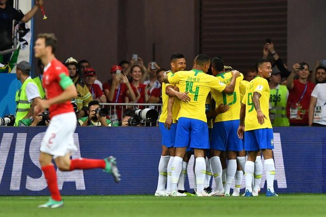 Brazils players celebrate a goal by forward Philippe Coutinho during the Russia 2018 World Cup Group E football match between Brazil and Switzerland at the Rostov Arena in Rostov-On-Don on June 17, 2018. / AFP PHOTO / JOE KLAMAR / RESTRICTED TO EDITORIAL USE - NO MOBILE PUSH ALERTS/DOWNLOADSEditoria: SPOLocal: Rostov-on-DonIndexador: JOE KLAMARSecao: soccerFonte: AFPFotógrafo: STF Brazils players celebrate a goal by forward Philippe Coutinho during the Russia 2018 World Cup Group E football match between Brazil and Switzerland at the Rostov Arena in Rostov-On-Don on June 17, 2018. / AFP PHOTO / JOE KLAMAR / RESTRICTED TO EDITORIAL USE - NO MOBILE PUSH ALERTS/DOWNLOADSEditoria: SPOLocal: Rostov-on-DonIndexador: JOE KLAMARSecao: soccerFonte: AFPFotógrafo: STF