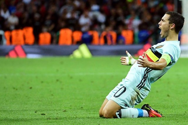 Belgiums forward Eden Hazard celebrates after scoring his teams third goal during the Euro 2016 round of 16 football match between Hungary and Belgium at the Stadium Municipal in Toulouse on June 26, 2016. EMMANUEL DUNAND / AFP Belgiums forward Eden Hazard celebrates after scoring his teams third goal during the Euro 2016 round of 16 football match between Hungary and Belgium at the Stadium Municipal in Toulouse on June 26, 2016. EMMANUEL DUNAND / AFP