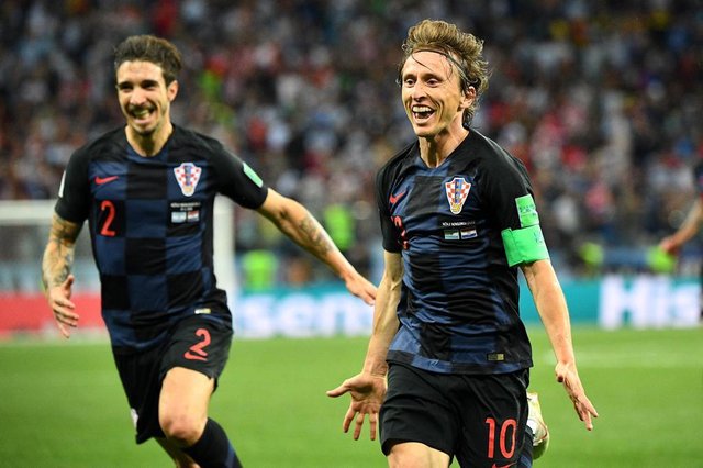 Croatias midfielder Luka Modric (R) celebrates after scoring their second goal during the Russia 2018 World Cup Group D football match between Argentina and Croatia at the Nizhny Novgorod Stadium in Nizhny Novgorod on June 21, 2018. / AFP PHOTO / Johannes EISELE / RESTRICTED TO EDITORIAL USE - NO MOBILE PUSH ALERTS/DOWNLOADSEditoria: SPOLocal: Nizhniy NovgorodIndexador: JOHANNES EISELESecao: soccerFonte: AFPFotógrafo: STF Croatias midfielder Luka Modric (R) celebrates after scoring their second goal during the Russia 2018 World Cup Group D football match between Argentina and Croatia at the Nizhny Novgorod Stadium in Nizhny Novgorod on June 21, 2018. / AFP PHOTO / Johannes EISELE / RESTRICTED TO EDITORIAL USE - NO MOBILE PUSH ALERTS/DOWNLOADSEditoria: SPOLocal: Nizhniy NovgorodIndexador: JOHANNES EISELESecao: soccerFonte: AFPFotógrafo: STF