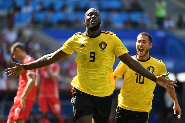 Belgiums forward Romelu Lukaku celebrates scoring his teams second goal during the Russia 2018 World Cup Group G football match between Belgium and Tunisia at the Spartak Stadium in Moscow on June 23, 2018. / AFP PHOTO / Kirill KUDRYAVTSEV / RESTRICTED TO EDITORIAL USE - NO MOBILE PUSH ALERTS/DOWNLOADSEditoria: SPOLocal: MoscowIndexador: KIRILL KUDRYAVTSEVSecao: soccerFonte: AFPFotógrafo: STF Belgiums forward Romelu Lukaku celebrates scoring his teams second goal during the Russia 2018 World Cup Group G football match between Belgium and Tunisia at the Spartak Stadium in Moscow on June 23, 2018. / AFP PHOTO / Kirill KUDRYAVTSEV / RESTRICTED TO EDITORIAL USE - NO MOBILE PUSH ALERTS/DOWNLOADSEditoria: SPOLocal: MoscowIndexador: KIRILL KUDRYAVTSEVSecao: soccerFonte: AFPFotógrafo: STF