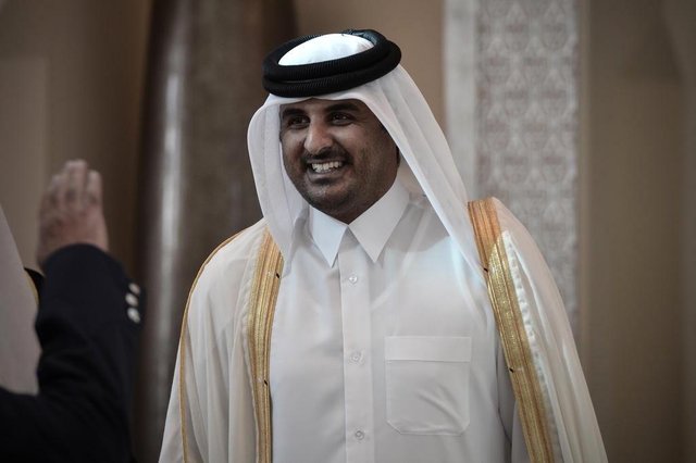(FILES)- A December 24, 2012, file photo shows Qatari Crown Prince Sheikh Tamim bin Hamad al-Thani smiling as he arrives in the Bahraini capital of Manama, to attend the annual Gulf Cooperation Council (GCC) summit. The Emir of Qatar, Sheikh Hamad bin Khalifa al-Thani, is expected to meet members of the royal family on June 24, 2013, with Qatari officials and diplomats saying a transfer of power to his son, Crown Prince Sheikh Tamim bin Hamad al-Thani, is imminent. AFP PHOTO / MOHAMMED AL-SHAIKH (FILES)- A December 24, 2012, file photo shows Qatari Crown Prince Sheikh Tamim bin Hamad al-Thani smiling as he arrives in the Bahraini capital of Manama, to attend the annual Gulf Cooperation Council (GCC) summit. The Emir of Qatar, Sheikh Hamad bin Khalifa al-Thani, is expected to meet members of the royal family on June 24, 2013, with Qatari officials and diplomats saying a transfer of power to his son, Crown Prince Sheikh Tamim bin Hamad al-Thani, is imminent. AFP PHOTO / MOHAMMED AL-SHAIKH