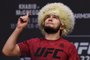 LAS VEGAS, NEVADA - OCTOBER 05: UFC lightweight champion Khabib Nurmagomedov poses during a ceremonial weigh-in for UFC 229 at T-Mobile Arena on October 05, 2018 in Las Vegas, Nevada. Nurmagomedov will defend his title against Conor McGregor at UFC 229 on October 6 at T-Mobile Arena in Las Vegas.   Ethan Miller/Getty Images/AFP