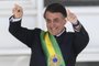  Brazils new president Jair Bolsonaro gestures after receiveing the presidential sash from outgoing Brazilian president Michel Temer (out of frame), at Planalto Palace in Brasilia on January 1, 2019. - Bolsonaro takes office with promises to radically change the path taken by Latin Americas biggest country by trashing decades of centre-left policies. (Photo by EVARISTO SA / AFP)Editoria: POLLocal: BrasíliaIndexador: EVARISTO SASecao: governmentFonte: AFPFotógrafo: STF