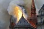  Flames burn the roof of the landmark Notre-Dame Cathedral in central Paris on April 15, 2019, potentially involving renovation works being carried out at the site, the fire service said. - A major fire broke out at the landmark Notre-Dame Cathedral in central Paris sending flames and huge clouds of grey smoke billowing into the sky, the fire service said. The flames and smoke plumed from the spire and roof of the gothic cathedral, visited by millions of people a year, where renovations are currently underway. (Photo by FRANCOIS GUILLOT / AFP)Editoria: DISLocal: ParisIndexador: FRANCOIS GUILLOTSecao: fireFonte: AFPFotógrafo: STF