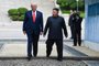 North Korea's leader Kim Jong Un and US President Donald Trump cross south of the Military Demarcation Line that divides North and South Korea, after Trump briefly stepped over to the northern side, in the Joint Security Area (JSA) of Panmunjom in the Demilitarized zone (DMZ) on June 30, 2019. (Photo by Brendan Smialowski / AFP)