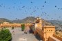 Suraj Pol (Sun Gate) in Jaleb Chowk (main courtyard) of Amber Fort in  Jaipur.UNDATED -- BC-TRAVEL-TIMES-36-JAIPUR-ART-NYTSF â Samir Kasliwal shows a necklace to a customer at Gem Palace, a longtime jewelry store in Jaipur.  Nearly 300 years ago, an enlightened maharajah with a penchant for jewels and an eye for architecture built a planned city amid the arid hills of northwest India. Called Jaipur after the cityâs founder, Jai Singh II, it arose on a grid of urban sectors not just for royal palaces, but for the workshops of artisans recruited to establish a new commercial hub. These days, gem cutters, jewelry designers and garment-makers are still flourishing in one of Indiaâs most popular tourist and shopping destinations, part of the Delhi-Agra-Jaipur Golden Triangle. (CREDIT: Poras Chaudhary/The New York Times) -- ONLY FOR USE WITH ARTICLE SLUGGED -- BC-TRAVEL-TIMES-36-JAIPUR-ART-NYTSF -- OTHER USE PROHIBITED.Editoria: TRALocal: KurukshetraIndexador: Poras ChaudharyFonte: NYTNSFotógrafo: STR
