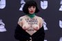 EDITORS NOTE: Graphic content / Chilean singer Mon Laferte, exposes her breast with writings reading In Chile they torture, rape and kill, as she arrives at the 20th Annual Latin Grammy Awards in Las Vegas, Nevada, on November 14, 2019. (Photo by Bridget BENNETT / AFP)