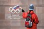 (FILES) In this file photograph taken on December 5, 2017, a supporter waves a Russian flag in front of the logo of the International Olympic Committee (IOC) at their headquarters in Pully near Lausanne. - In Russia, where criticism of the authorities can lead to dire consequences, the head of the countrys anti-doping agency Yury Ganus has openly accused officials of tampering with data handed to the global watchdog. Its dangerous but its my mission, the head of RUSADA told AFP, asked if he felt afraid after assigning blame to the sports ministry and Russian law enforcement. The executive of the World Anti-Doping Agency (WADA) is to meet in Lausanne, Switzerland on December 9, 2019, to decide on a proposed four-year international ban of Russian athletes over the handling of doping allegations. (Photo by Fabrice COFFRINI / AFP)
