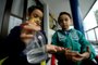  CAXIAS DO SUL, RS, BRASIL, 03/04/2020Cuidados com o alcool gel com as crianças. João Gabriel Marques, 9 anos e Miguel Francisco Marques 5 anos<!-- NICAID(14468638) -->
