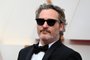 (FILES) In this file photo taken on February 09, 2020 US actor Joaquin Phoenix arrives for the 92nd Oscars at the Dolby Theatre in Hollywood, California. - Joaquin Phoenixs latest film isnt an easy watch -- and given its stark anti-meat agenda, it isnt meant to be.The Joker star and vegan activist executive-produced Gunda, a stripped-down, black-and-white movie delivering intimate portraits of a cast of adorable farmyard animals. (Photo by Robyn Beck / AFP)<!-- NICAID(14668805) -->