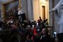  Supporters of US President Donald Trump protest in the US Capitols Rotunda on January 6, 2021, in Washington, DC. - Demonstrators breeched security and entered the Capitol as Congress debated the a 2020 presidential election Electoral Vote Certification. (Photo by Saul LOEB / AFP)Editoria: POLLocal: WashingtonIndexador: SAUL LOEBSecao: electionFonte: AFPFotógrafo: STF<!-- NICAID(14684755) -->
