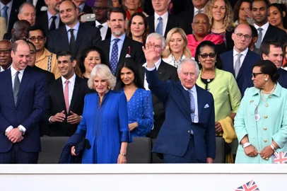 Britain's Queen Camilla (2L) and Britain's King Charles III (2R) react as they attend the Coronation Concert at Windsor Castle in Windsor, west of London on May 7, 2023. - For the first time ever, the East Terrace of Windsor Castle will host a spectacular live concert that will also be seen in over 100 countries around the world. The event will be attended by 20,000 members of the public from across the UK. (Photo by Leon Neal / POOL / AFP)<!-- NICAID(15422547) -->