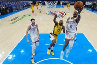OKLAHOMA CITY, OKLAHOMA - JUNE 16: Shai Gilgeous-Alexander #2 of the Oklahoma City Thunder shoots a layup in front of Aaron Nesmith #23 of the Indiana Pacers as Chet Holmgren #7 of the Oklahoma City Thunder looks on during the fourth quarter in Game Five of the 2025 NBA Finals at Paycom Center on June 16, 2025 in Oklahoma City, Oklahoma. NOTE TO USER: User expressly acknowledges and agrees that, by downloading and or using this photograph, User is consenting to the terms and conditions of the Getty Images License Agreement.   Nate Billings - Pool/Getty Images/AFP (Photo by POOL / GETTY IMAGES NORTH AMERICA / Getty Images via AFP)<!-- NICAID(16062261) -->