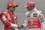 Brazilian Formula One driver Felipe Massa (L) of Ferrari shakes hands with British Lewis Hamilton of McLaren on November 2, 2008 at the Interlagos race track in Sao Paulo, Brazil. Hamilton and Massa will decide the 2008 F1 championship.  AFP PHOTO MAURICIO LIMA (Photo by MAURICIO LIMA / AFP)Editoria: SPOLocal: Sao PauloIndexador: MAURICIO LIMASecao: motor racingFonte: AFP<!-- NICAID(15394389) -->