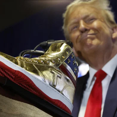PHILADELPHIA, PENNSYLVANIA - FEBRUARY 17: Republican presidential candidate and former President Donald Trump delivers remarks while introducing a new line of signature shoes at Sneaker Con at the Philadelphia Convention Center on February 17, 2024 in Philadelphia, Pennsylvania. Sneaker Con was founded in 2009 and is one of the oldest events celebrating sneakers, streetwear and urban culture. Trump addressed the event one day after a judge ordered the former president to pay $354 million in his New York civil fraud trial.   Chip Somodevilla/Getty Images/AFP (Photo by CHIP SOMODEVILLA / GETTY IMAGES NORTH AMERICA / Getty Images via AFP)<!-- NICAID(15683394) -->