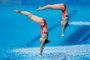China's Shi Tingmao and China's Wang Han compete to win the gold medal in the women's synchronised 3m springboard diving final event during the Tokyo 2020 Olympic Games at the Tokyo Aquatics Centre in Tokyo on July 25, 2021. (Photo by Odd ANDERSEN / AFP)<!-- NICAID(14844068) -->