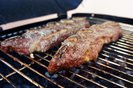 Assado de Tira or Strip roast. Traditional beef rib cut for a delicious barbecue on wooden backgroundFonte: 430509632<!-- NICAID(15743334) -->