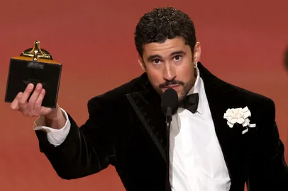 LOS ANGELES, CALIFORNIA - FEBRUARY 01: Bad Bunny accepts the Album of the Year award for "DeBÍ TiRAR MáS FOToSonstage during the 68th GRAMMY Awards at Crypto.com Arena on February 01, 2026 in Los Angeles, California.   Kevin Winter/Getty Images for The Recording Academy/AFP (Photo by KEVIN WINTER / GETTY IMAGES NORTH AMERICA / Getty Images via AFP)<!-- NICAID(16216788) -->