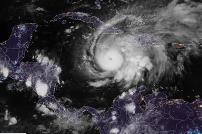 This RAMMB/CIRA handout satellite image shows Hurricane Melissa southeast of Jamaica at 03:30 UTC on October 26, 2025. Hurricane Melissa was cutting a deadly path in the Caribbean on the night of October 25, with rapid intensification expected over the weekend as it took a worryingly slow course toward Jamaica and the island of Hispaniola, forecasters said. (Photo by RAMMB/CIRA / AFP) / RESTRICTED TO EDITORIAL USE - MANDATORY CREDIT "AFP PHOTO / RAMMB/CIRA " - HANDOUT - NO MARKETING NO ADVERTISING CAMPAIGNS - DISTRIBUTED AS A SERVICE TO CLIENTS<!-- NICAID(16154488) -->