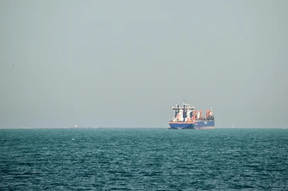 A commercial vessel is pictured offshore in Dubai on March 11, 2026. New attacks hit three commercial ships in the Gulf on March 11, with one of the vessels in flames as Iran pressed its campaign against its oil-exporting neighbours, threatening shipping in the Strait of Hormuz and plunging the global energy economy into crisis. (Photo by AFP) / Attention editors: AFP covers the war in the Middle East through its extensive regional network, including bureaus in Tehran, Jerusalem and several neighboring countries.Since the start of the conflict, journalists have been working under increasingly restrictive conditions. Authorities in several countries have limited reporters movements, photo and live video coverage from sensitive locations. Some governments and armed groups have banned images of missile or drone strikes and other security-related sites. / <!-- NICAID(16244151) -->